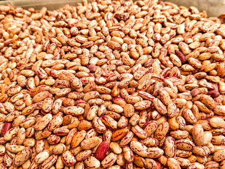 Various types of beans display vibrant colors and patterns, showing their freshness and quality at a...