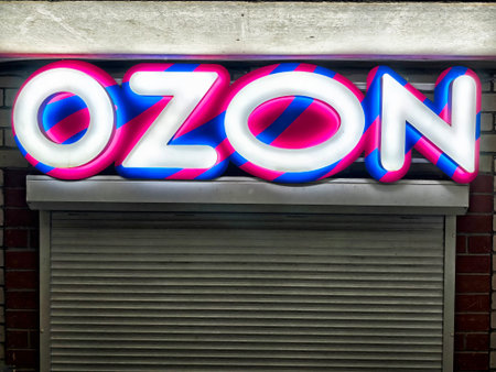 Kirov, Russia - September 01, 2025: Brightly lit storefront sign displays the Ozon brand name, inviting customers to explore various products available online.のeditorial素材