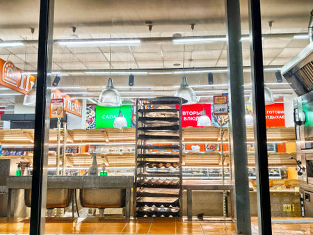 Kirov, Russia - September 03, 2025: Customers notice empty shelves and a busy atmosphere in the grocery store during evening shopping hours in the city.のeditorial素材