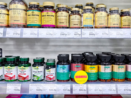 Kirov, Russia - August 30, 2025: Various bottles of dietary supplements are displayed on a pharmacy shelf, showing options for health and wellness.のeditorial素材