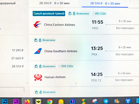 Kirov, Russia - September 24, 2025: Display of flight choices from Vladivostok to Beijing presenting...