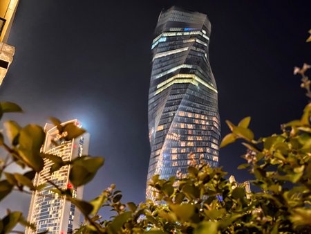 Manama, Bahrain - September 28, 2025: A unique twisting skyscraper stands tall in Manama, Bahrain,...
