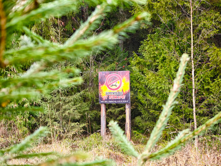 Kirov, Russia - October 28, 2025: Environmental poster concept calling to protect forests from fires, highlighting wildfire danger, human responsibility, prevention measures and nature conservation.のeditorial素材