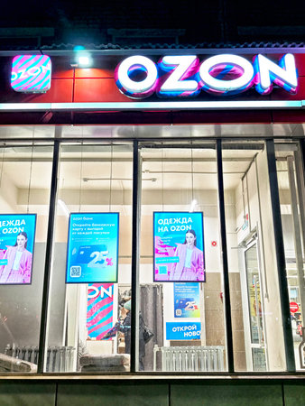 Kirov, Russia - November 19, 2025: The store exterior shows the Ozone sign lit up at night,...