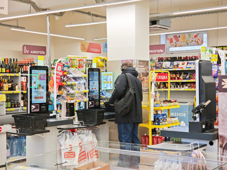 Kirov, Russia - January 07, 2026: Customers are shopping and paying at the checkout area of a...