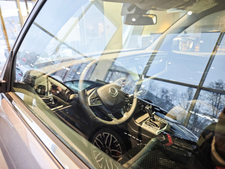 Kirov, Russia - January 20, 2026: Modern car dealership showroom with new SUVs and crossovers, professional automotive retail and buying concept, Car in showroom of dealer Soueast, KGM and othersのeditorial素材