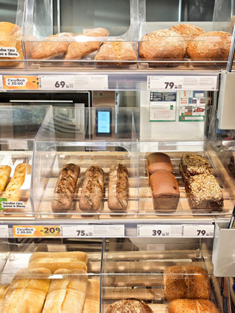 Kirov, Russia - December 14, 2025: Bakery items are neatly arranged on shelves in a grocery store....