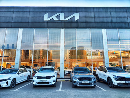 Tashkent, Uzbekistan - April 12, 2025: Entrance and Cars in showroom of dealership KIA
