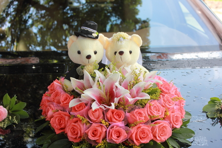 Flowers with bears on the carの写真素材