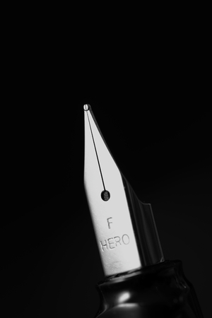Pen tip with black backgroundのeditorial素材