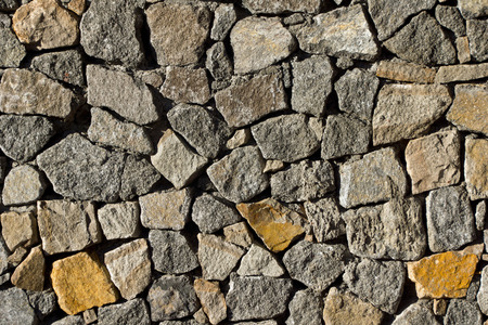 Detail of a stone wall, backgroundの写真素材
