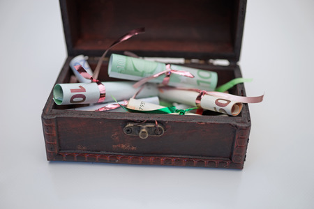 Wooden chest with Euro currency insideの写真素材