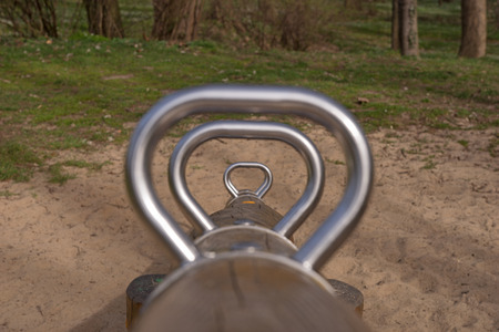 Silver seesaw on a playgroundの写真素材