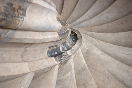 Ancient spiral stone stairs in the castle towerの写真素材