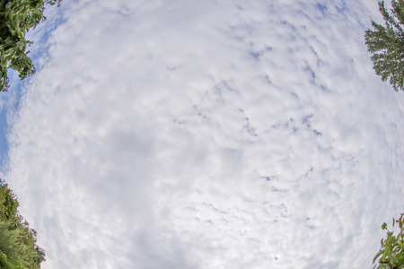 Clouds against the sky with wide angle fisheye