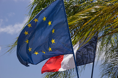 EU and France, Flags in front of blue skyの写真素材