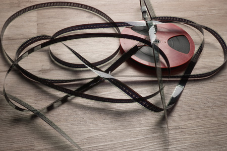 Old motion picture film reel on the tableの写真素材
