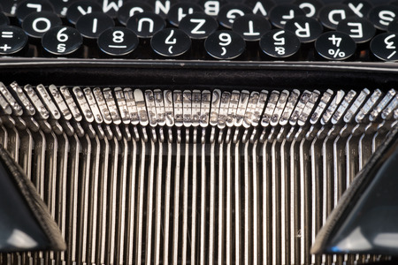 Closeup of old typewriter letter and symbol keysの写真素材