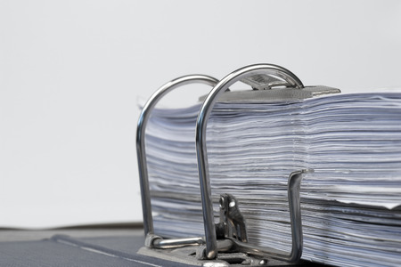 Open folder with documents filed on white background
