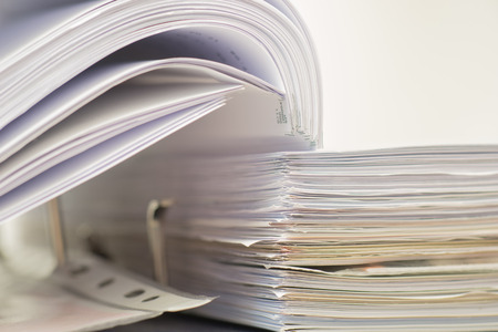 Open folder with documents filed on white background