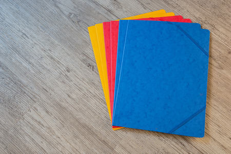 Folders in different colors.Office background