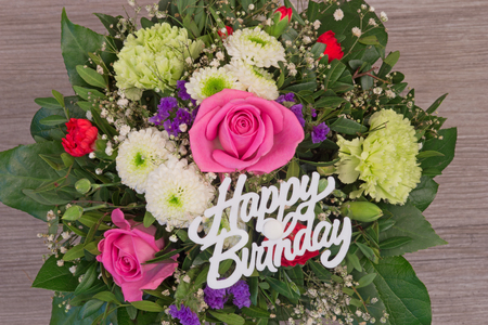 Bunch of colorful flowers, flower bouquet with text Happy Birthdayの写真素材