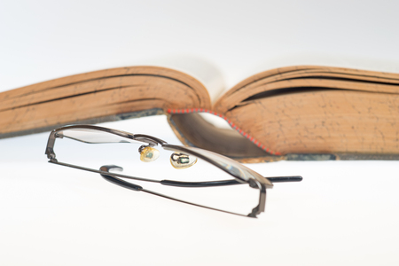 antique book with glasses, selective focusの写真素材