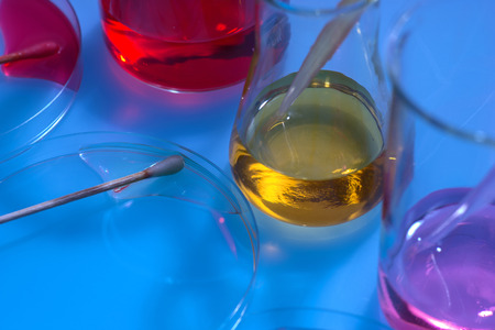 glass laboratory apparatus with color waterの写真素材