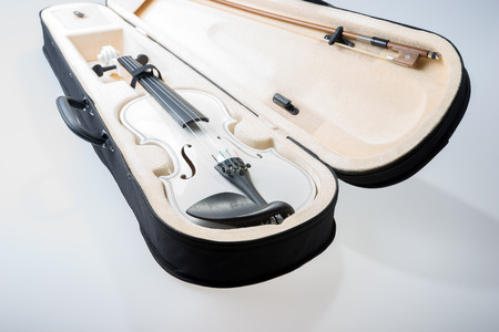 White violin with the bow in hard cover isolatedの写真素材