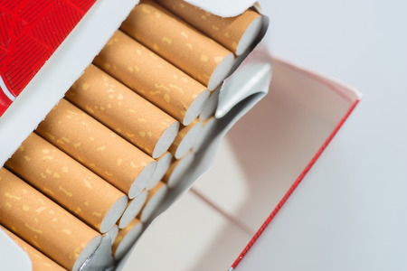 Open pack of cigarettes isolatedの写真素材