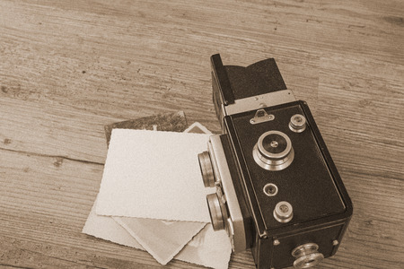 Old retro camera on wooden boards