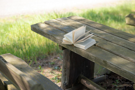 Open book on wooden tableの写真素材