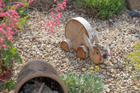 Rabbit of wood as a decoration in the gardenの写真素材