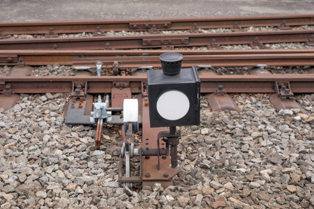 Hand-operated railroad switch with lever, weight and signalの写真素材