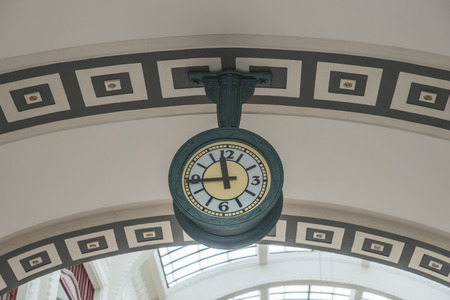 Hanging public clock, the clock hanging above the archの写真素材