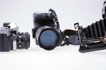 Modern and old cameras on white backgroundの写真素材