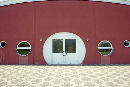 Round white door in a modern buildingの写真素材