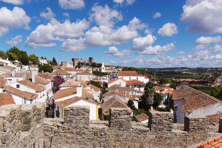Over the roofs of the old town of Obidos, a medieval town in Portugalの写真素材
