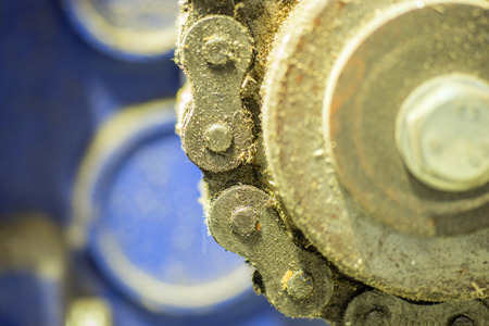 Closeup dirty ratchet gear with chain drive in metal processingの写真素材