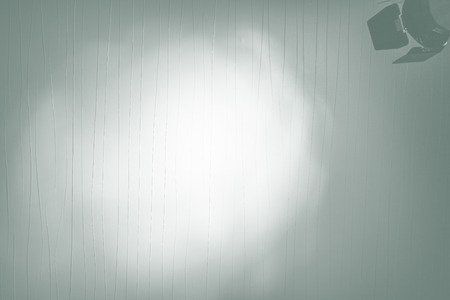 Spotlight on dark wall abstract background / room studio backgroundの写真素材