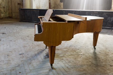 closeup of an old piano in an auditoriumの写真素材