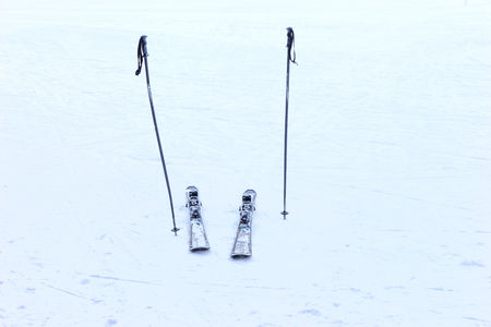 Ski poles and skis on the snowの写真素材