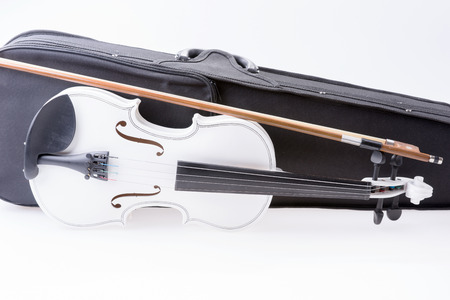 White violin with the bow isolated on white backgroundの写真素材