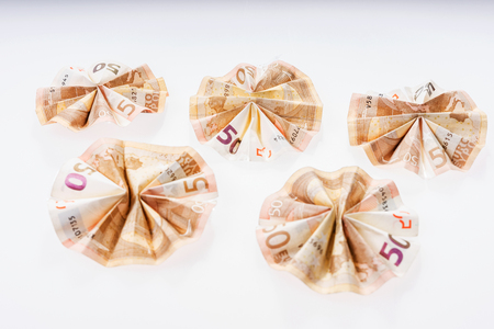 Five fifty euro bills folded in circular shapeの写真素材