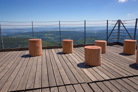 Wooden terrace with beautiful mountains in the backgroundの写真素材