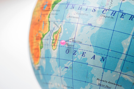 Location Reunion Island. Pink pin on the world globeの写真素材