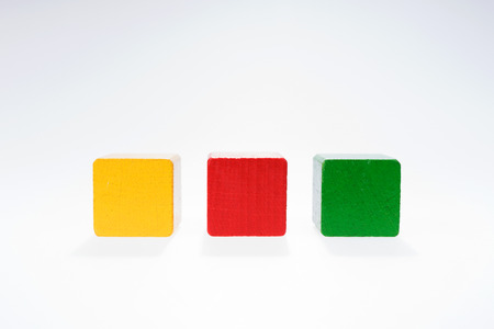 Three toys blocks, multicolor wooden building bricks