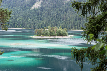 Small idyllic island in the Eibsee near Grainau in Bavaria, Germany