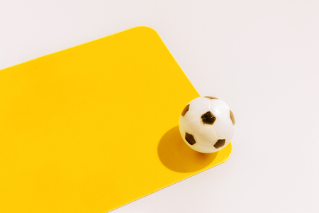 Yellow card isolated on white for sport conceptの写真素材