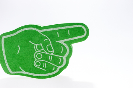 Green hand with extended index finger isolated on whiteの写真素材